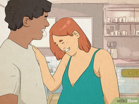 They might lightly touch each other on the hand or the arm.